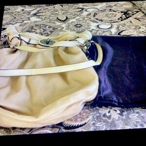 Coach shoulder bag . Used very little . Was never an everyday bag . Cream